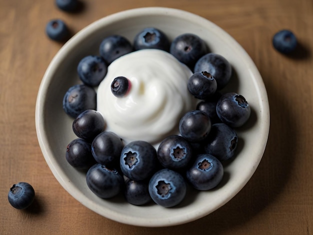 a bowl of blueberries with a yogurt in it