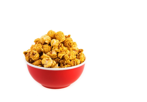 A bowl of caramel popcorn isolated on white background