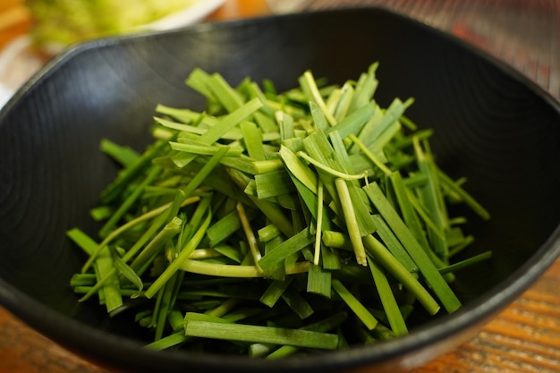 a bowl of chopped green beans with the other vegetables in it