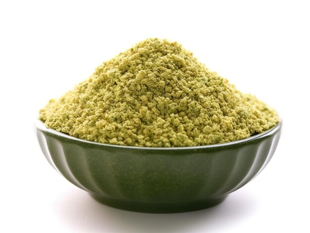 A bowl of chopped green oregano over a white background