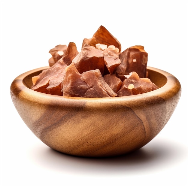 A bowl of chopped up food with a white background