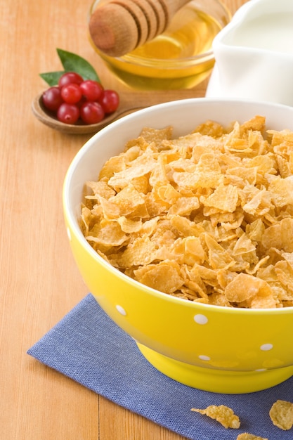 Bowl of corn and milk on wood