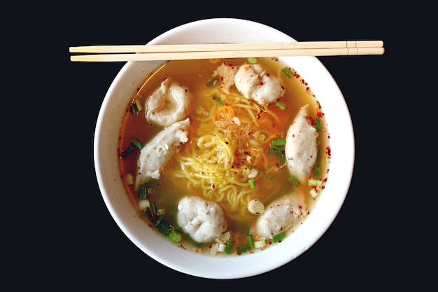 Bowl of Delectable Thai Egg Noodles Spicy Soup with Assorted Fish Balls