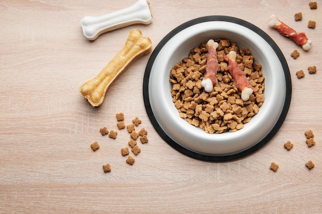 A bowl of dog food on a wooden floor