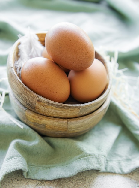 Bowl of eggs on concrete background