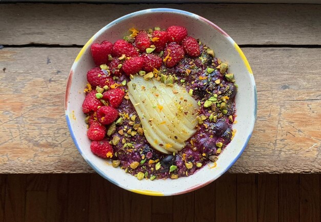 a bowl of food with berries and berries on it