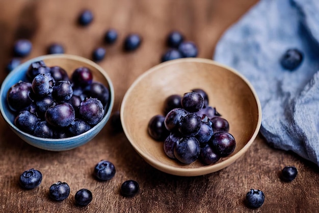 Bowl of fresh blueberries on blue rustic wooden table closeup