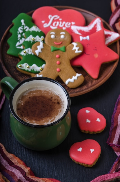 Bowl of gingerbread with mug of cocoa