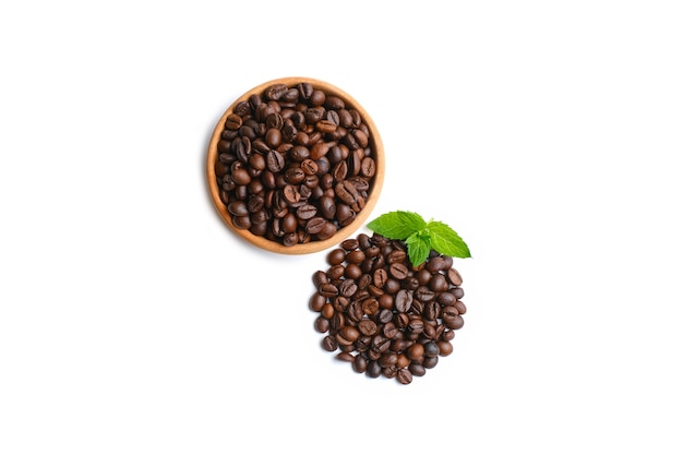 Bowl of ground coffee and beans isolated on white background, top view