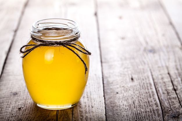 Bowl of honey on wooden table. Symbol of healthy living and natural medicine. Aromatic and tasty. and