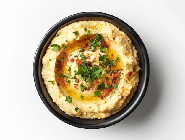 A bowl of hummus isolated on white background from top view Vegan food concept