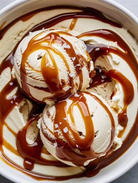 Photo a bowl of ice cream with caramel sauce and caramel sauce