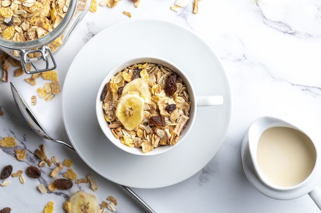 Bowl of milk with whole grains for breakfast Muesli with dried fruits and dried fruits With copy space