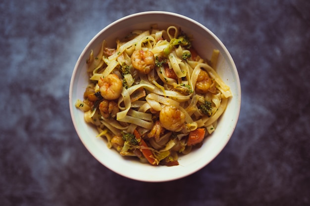 Bowl of noodles with vegetables and shrimp