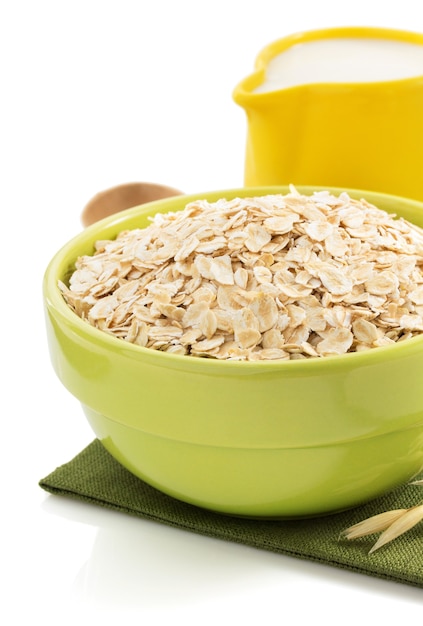 Bowl of oat flake isolated on white background