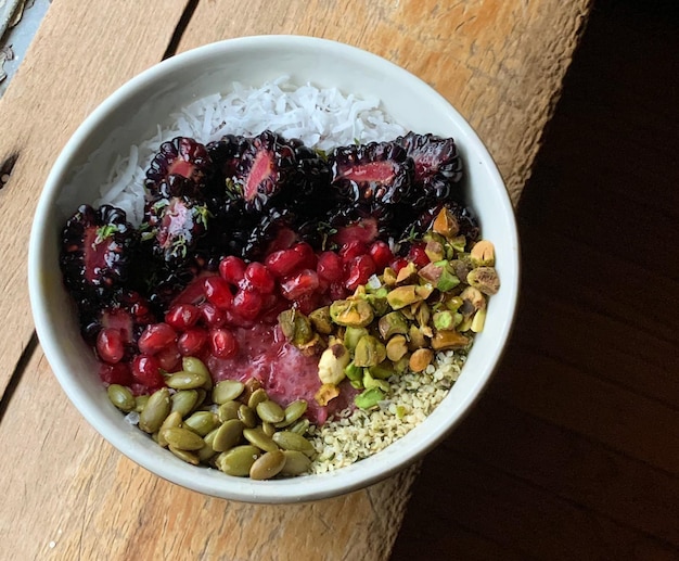 a bowl of oatmeal with berries and nuts