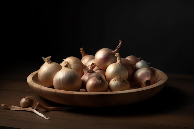 A bowl of onions sits on a table with a black background.