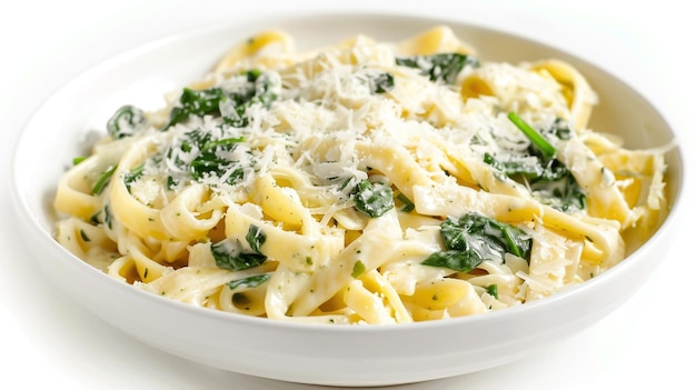 a bowl of pasta with cheese and spinach on it