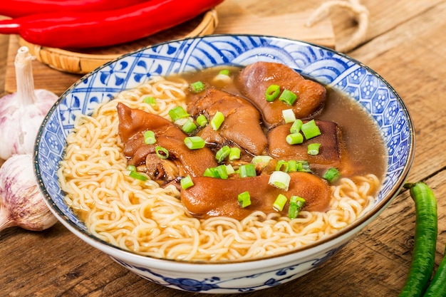 A bowl of pork knuckle noodles