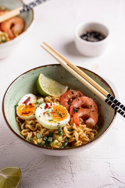 Bowl of ramen soup with shrimps and eggs