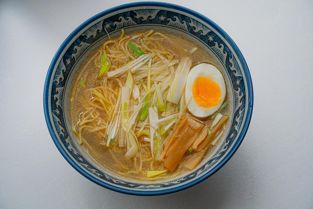 A bowl of ramen with a hard boiled egg on top