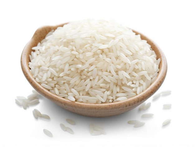 A bowl of rice sits on a white table.