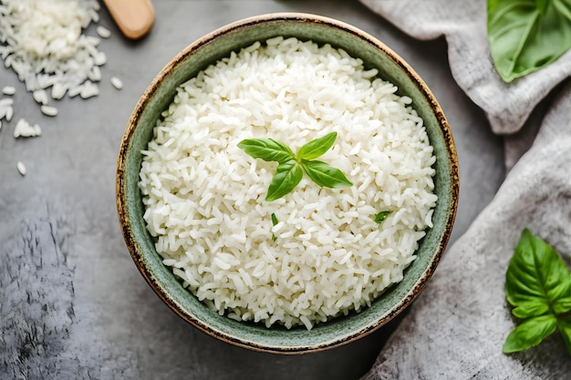 Photo a bowl of rice with a leafy plant on