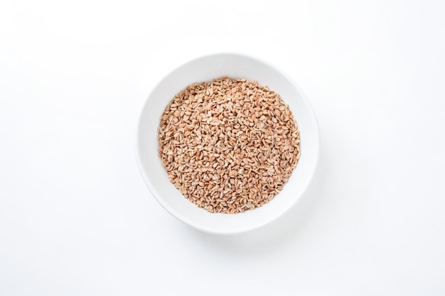 Bowl of Sesame Seeds on a White Background