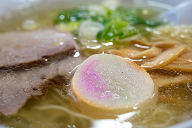 A bowl of soup with a pink mark on the bottom.