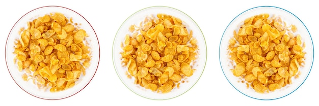 Bowl of sweet cornflakes with milk isolated on white background top view