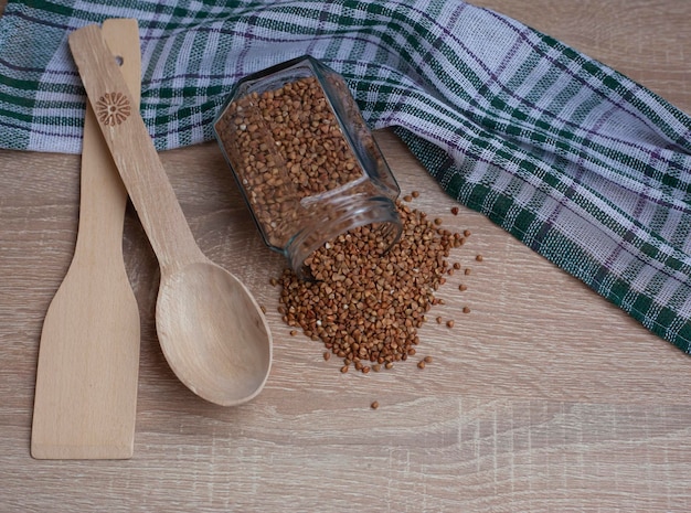 Bowl of tasty buckwheat porridge on table top view