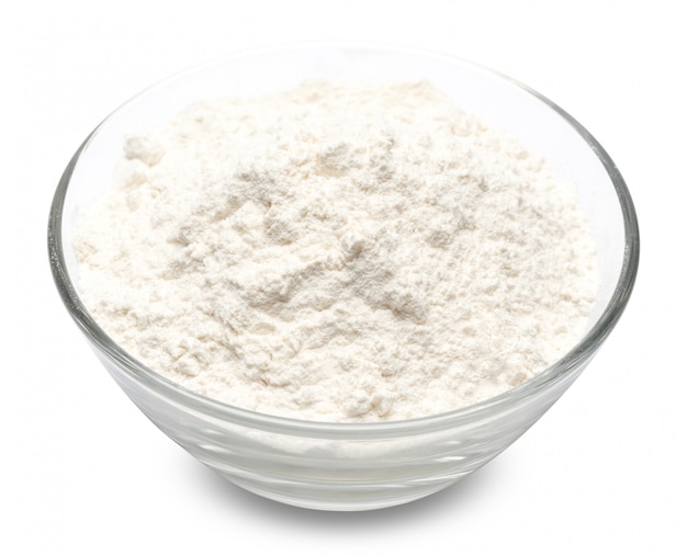 Bowl of wheat flour on white