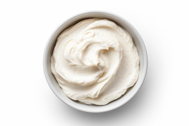 a bowl of whipped cream on a white surface