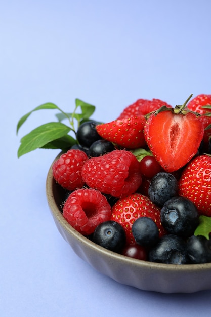 Bowl with berry mix on violet