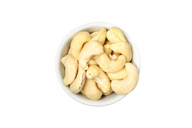 Bowl with cashew nuts isolated on white