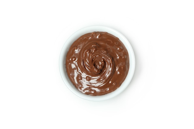 Bowl with chocolate paste isolated on white background