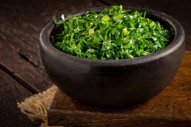 Bowl with chopped green cabbage sauteed in olive oil and garlic.