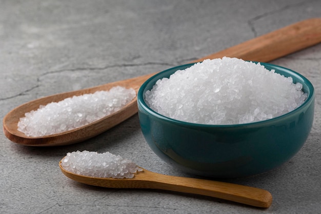 Bowl with coarse salt on the table