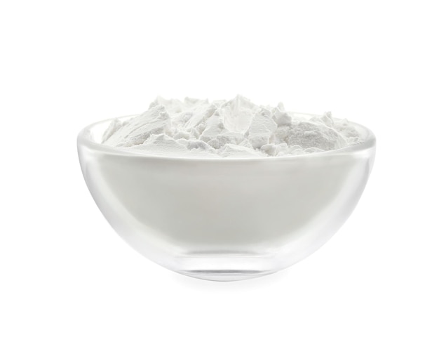 Bowl with corn starch on white background