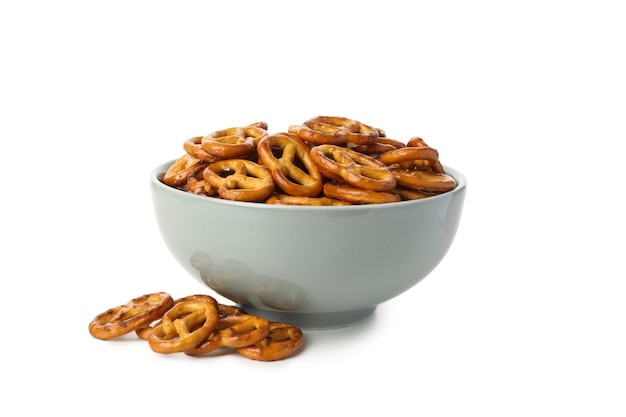 Bowl with cracker pretzels isolated on white