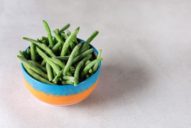 Bowl with Frozen Green Beans on Gray Background Healthy Vegan Food Copy Space