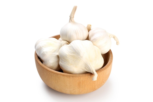 Bowl with garlic isolated on white background