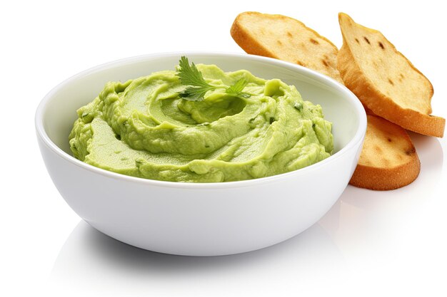 Bowl with guacamole avocado spread on toasted bread top view on white background