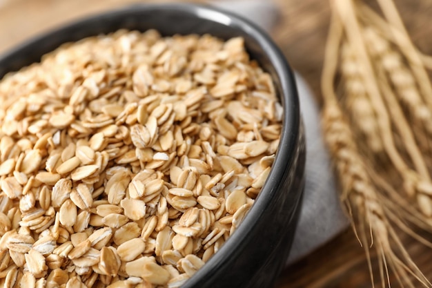 Bowl with oatmeal flakes closeup