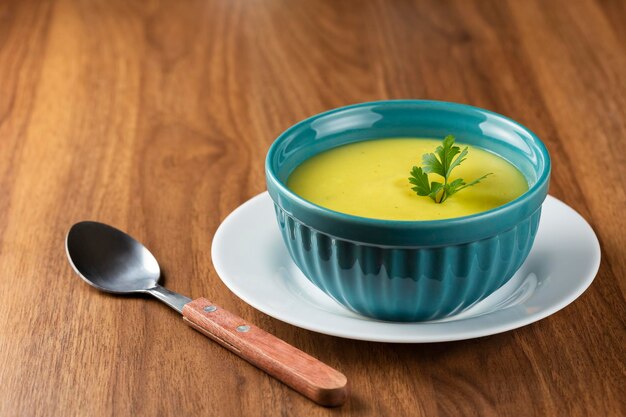 Bowl with onion soup and croutons on the table.