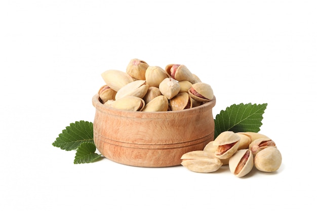 Bowl with pistachio isolated on white background