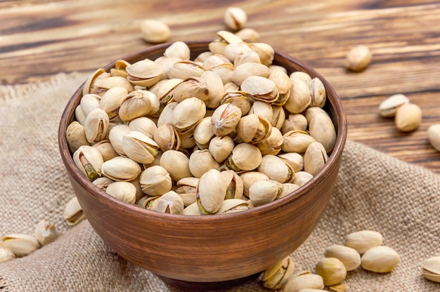 Bowl with pistachios on the table