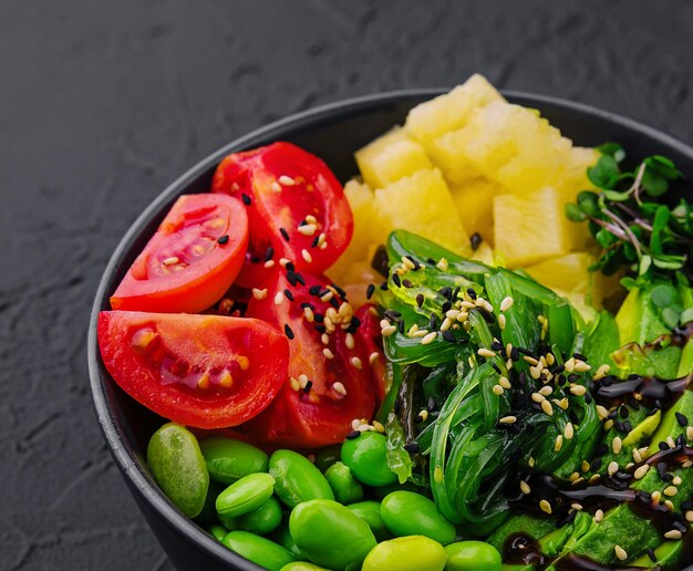 bowl with seaweed beans avocado and pineapple