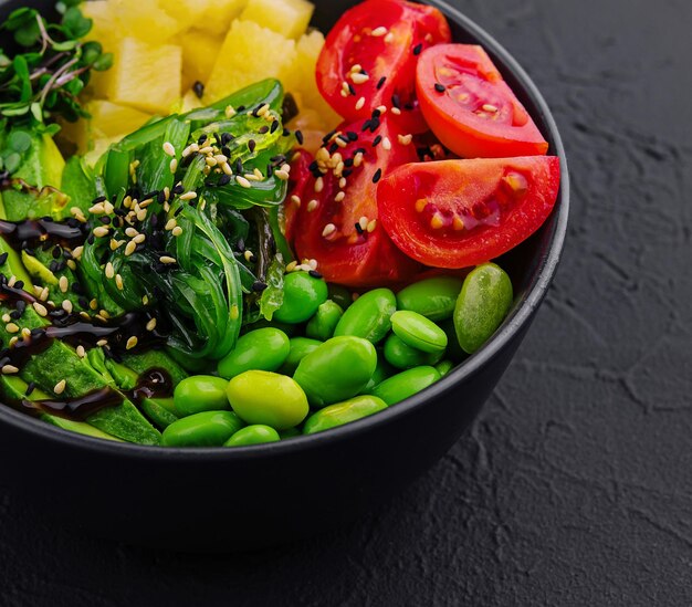 bowl with seaweed beans avocado and pineapple