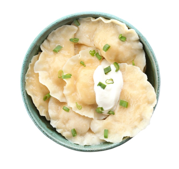 Bowl with tasty dumplings on white background